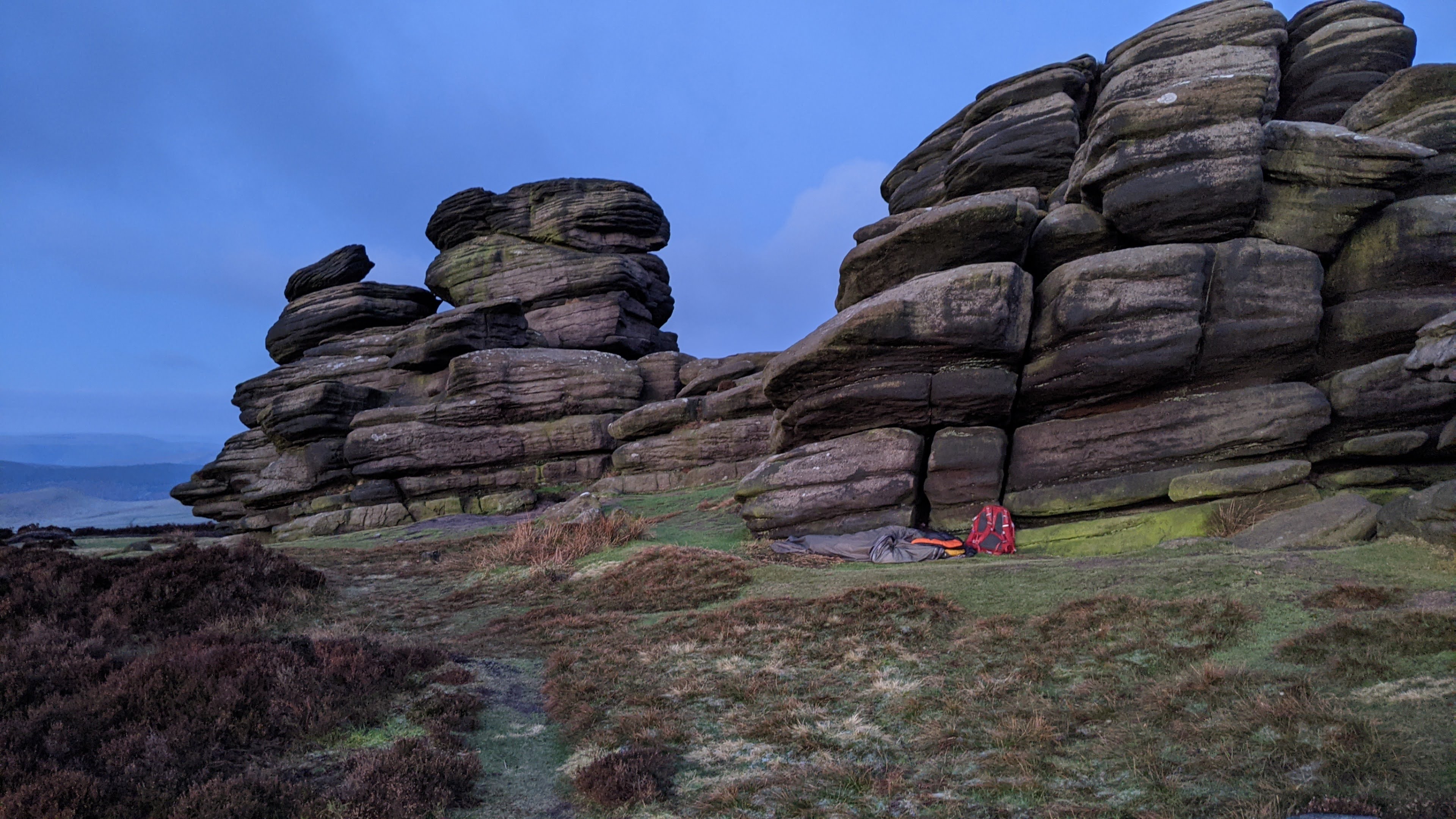 My bivvy and rucksack underneath the rock formation